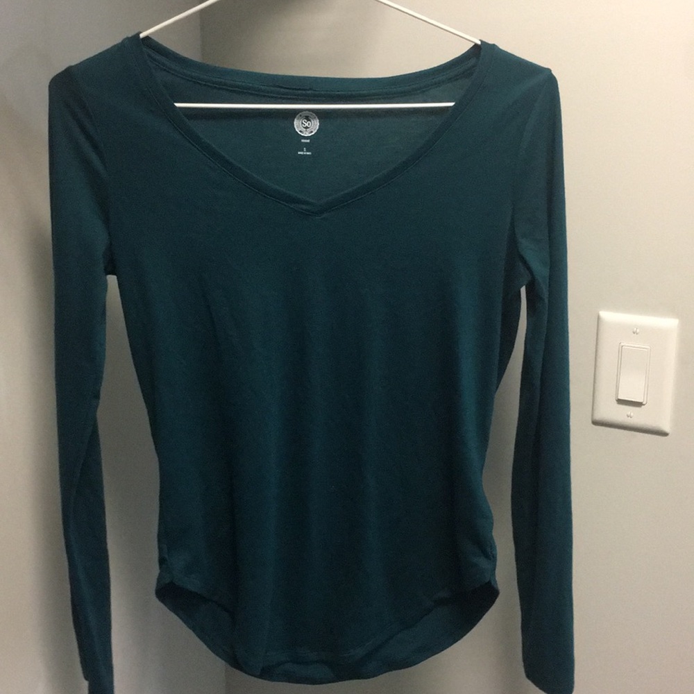 Long sleeve, blue-green colored tee shirt.